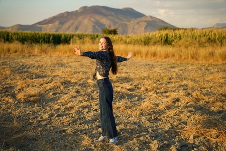 A Joyful Woman in the Embracing Nature Radiating Pure Happiness and Blissful Energy A Joyful Woman in the Embracing Nature Radiating Pure Happiness and Blissful Energy