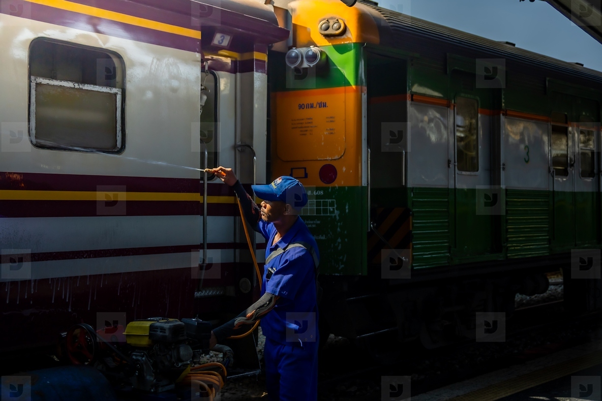 Bangkok  Thailand   March 3  Workers spray water to clean train