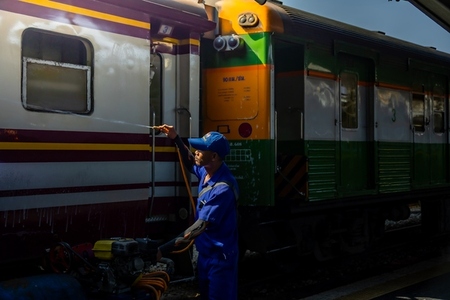 Bangkok  Thailand   March 3  Workers spray water to clean train