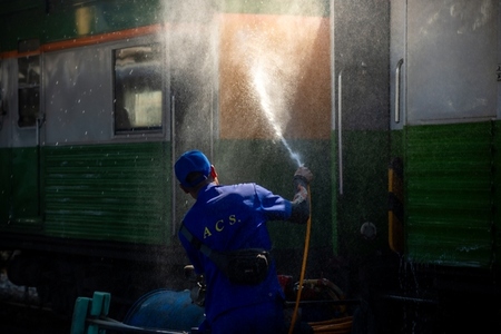 Bangkok  Thailand   March 3  Workers spray water to clean train