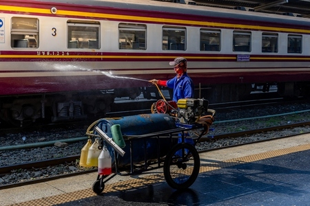 Bangkok  Thailand   March 3  Workers spray water to clean train