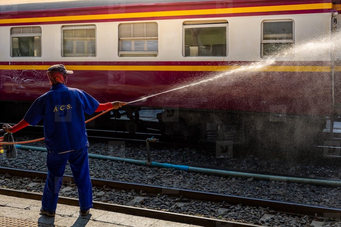 Bangkok Thailand March 3 Workers spray water to clean train