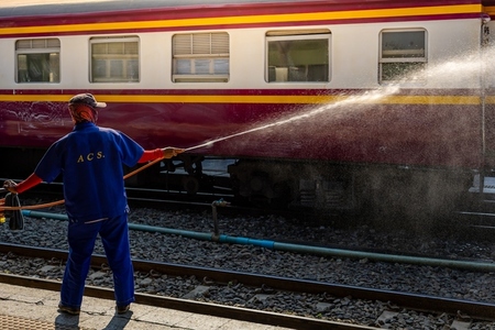 Bangkok  Thailand   March 3  Workers spray water to clean train