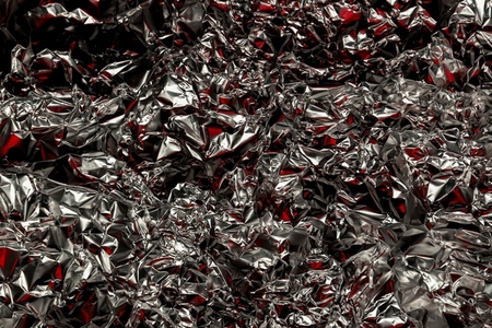 Shiny crumpled foil with silver and red reflections creating a metallic abstract design  Futuristic texture with chrome surface and cyberpunk background style