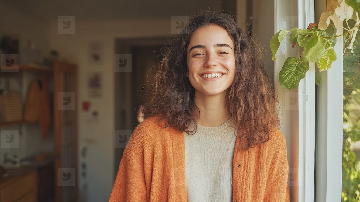 Cheerful woman standing doorway casual home natural smile Warm cheerful woman standing doorway
