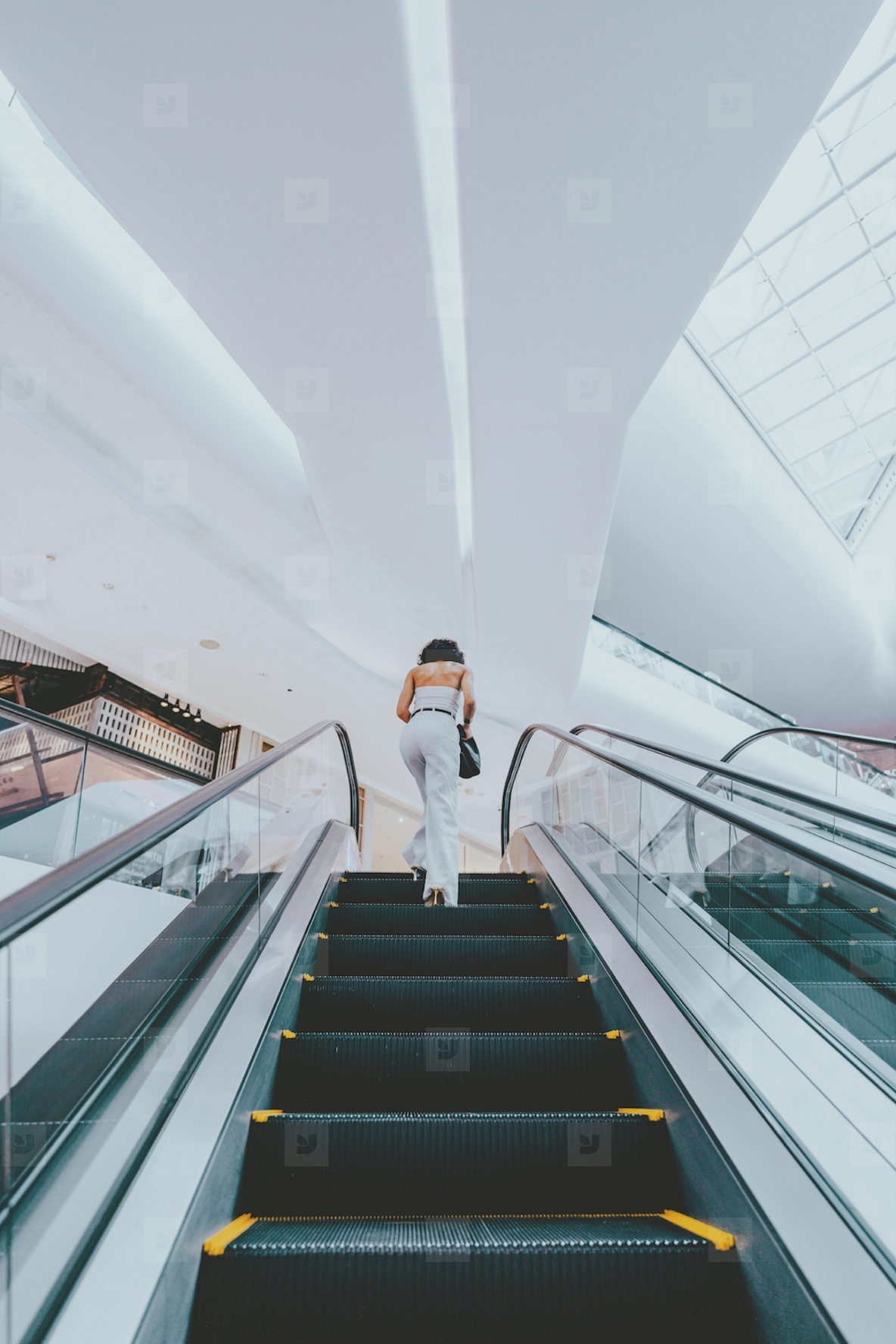 Woman and Escalator