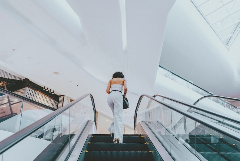 Woman and Escalator