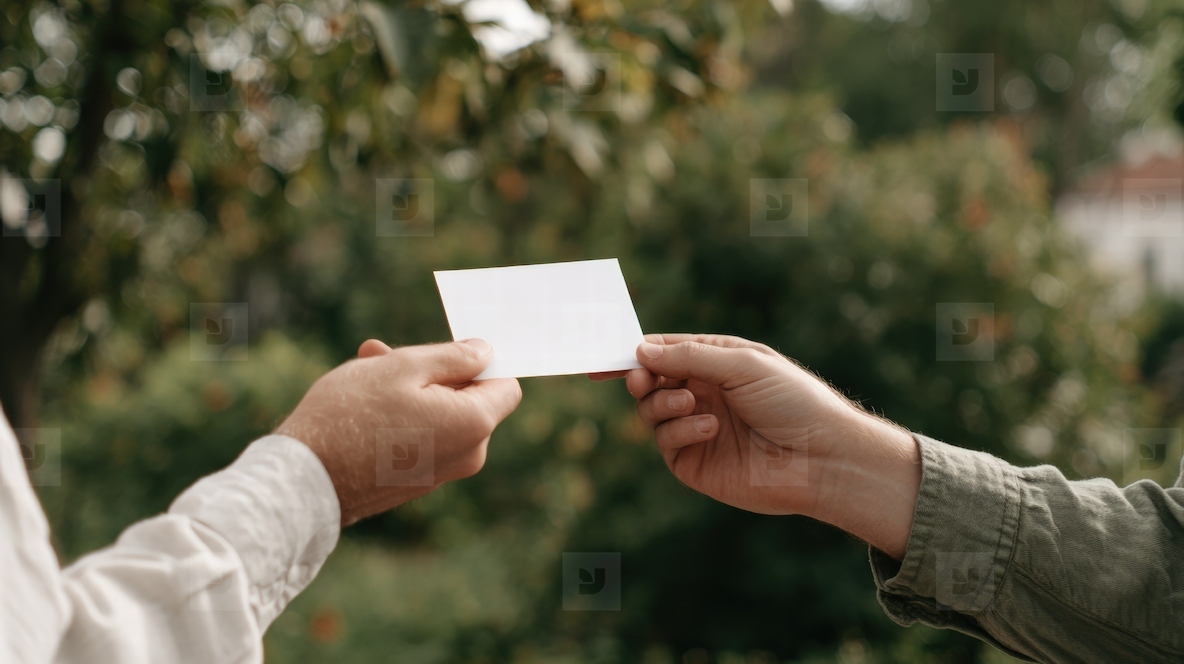 Blank card hand outdoor giving mockup nature green casual Blank card being handed over outdoors