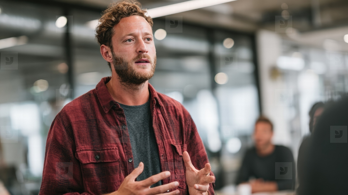 Startup founder pitching idea to investors in modern office  confident and passionate expression