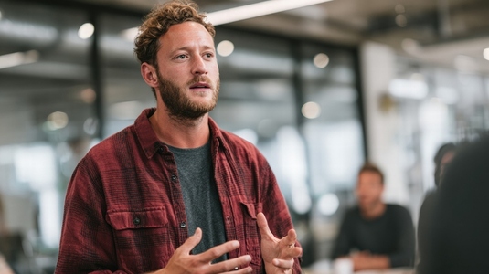 Startup founder pitching idea to investors in modern office  confident and passionate expression