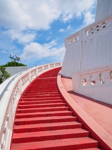 The red staircase leading up and down Golden mountain Phu Khao The red staircase leading up and down Golden mountain Phu Khao