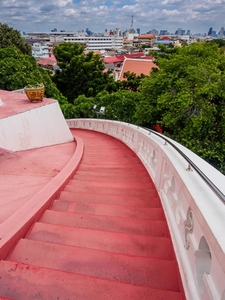 The red staircase leading up and down Golden mountain Phu Khao The red staircase leading up and down Golden mountain Phu Khao