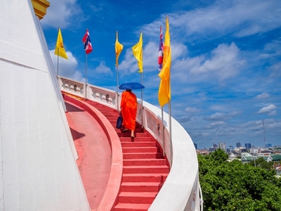 BANGKOK THAILAND AUGUST 25 2025 Monks hold umbrellas to sh BANGKOK THAILAND AUGUST 25 2025 Monks hold umbrellas to sh