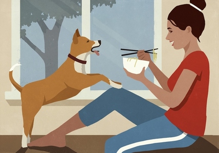 Playful dog jumping on happy woman eating noodles at window