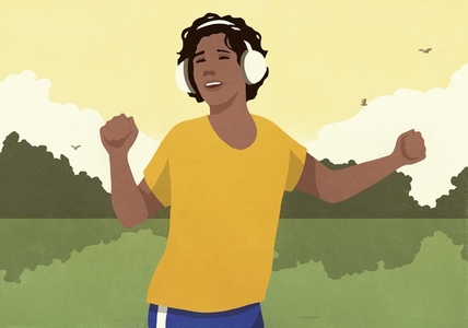 Happy woman with headphones listening to music and dancing