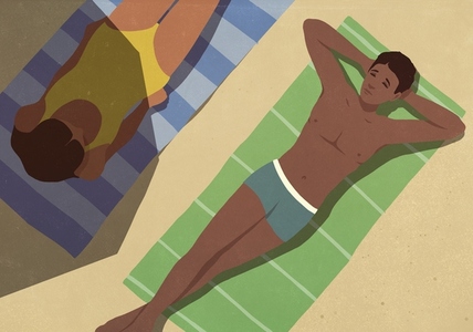 View from above of young couple sunbathing on towels on sunny beach