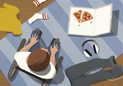 View from above of clothes and pizza box