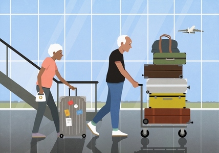 Active senior couple traveling pushing wheeled luggage and suitcase cart Active senior couple traveling pushing wheeled luggage and suitcase cart