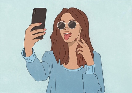Playful young woman making a face taking selfie with smart phone