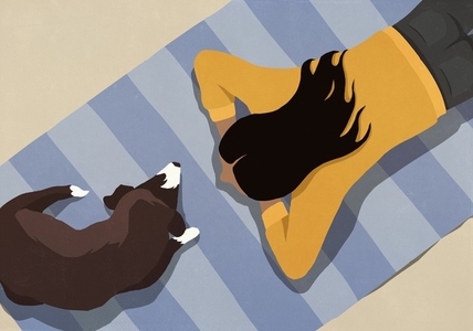 High angle view of woman relaxing laying on rug with dog at home