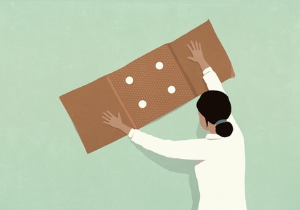 Female doctor placing large bandage over green background Female doctor placing large bandage over green background