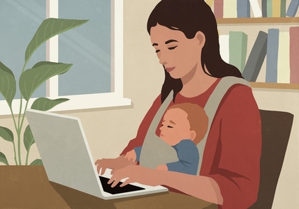 Mother working at laptop in home office with infant son in lap
