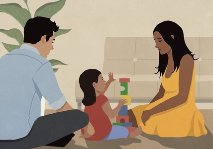 Parents playing with toddler daughter stacking wood blocks