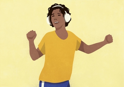 Carefree woman with headphones listening to music and dancing