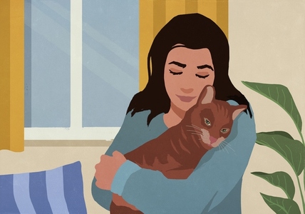 Serene affectionate woman cuddling with pet cat at home