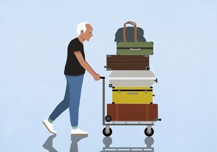 Active senior man traveling pushing cart with stacked luggage Active senior man traveling pushing cart with stacked luggage