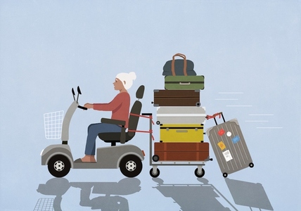 Active senior woman on the move in motorized wheelchair pulling suitcases
