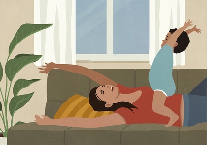 Carefree mother and toddler son playing with arms raised on living room Carefree mother and toddler son playing with arms raised on living room