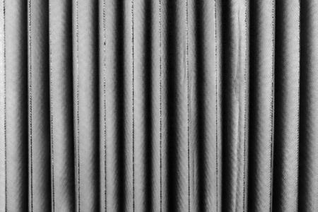 Vertical fabric folds with smooth textile texture soft light and elegant minimal pattern in monochrome design Vertical fabric folds with smooth textile texture soft light and elegant minimal pattern in monochrome design