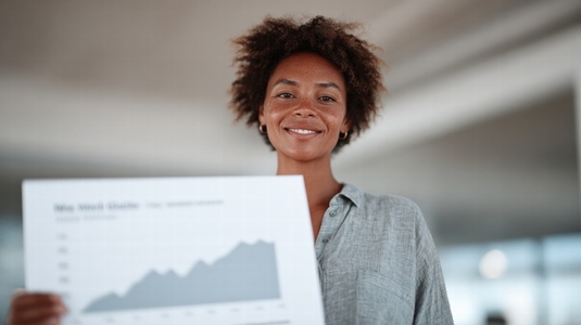 Empowered businesswoman showcasing global sales growth with positive expression  highlighting success and achievement