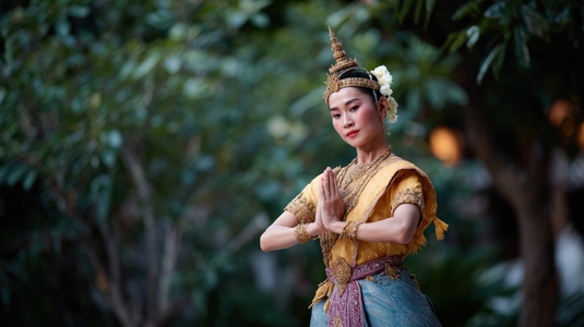 Traditional Thai classical dancer performing gracefully in vibrant costume showcasing cultural heritage and artistry Traditional Thai classical dancer performing gracefully in vibrant costume showcasing cultural heritage and artistry