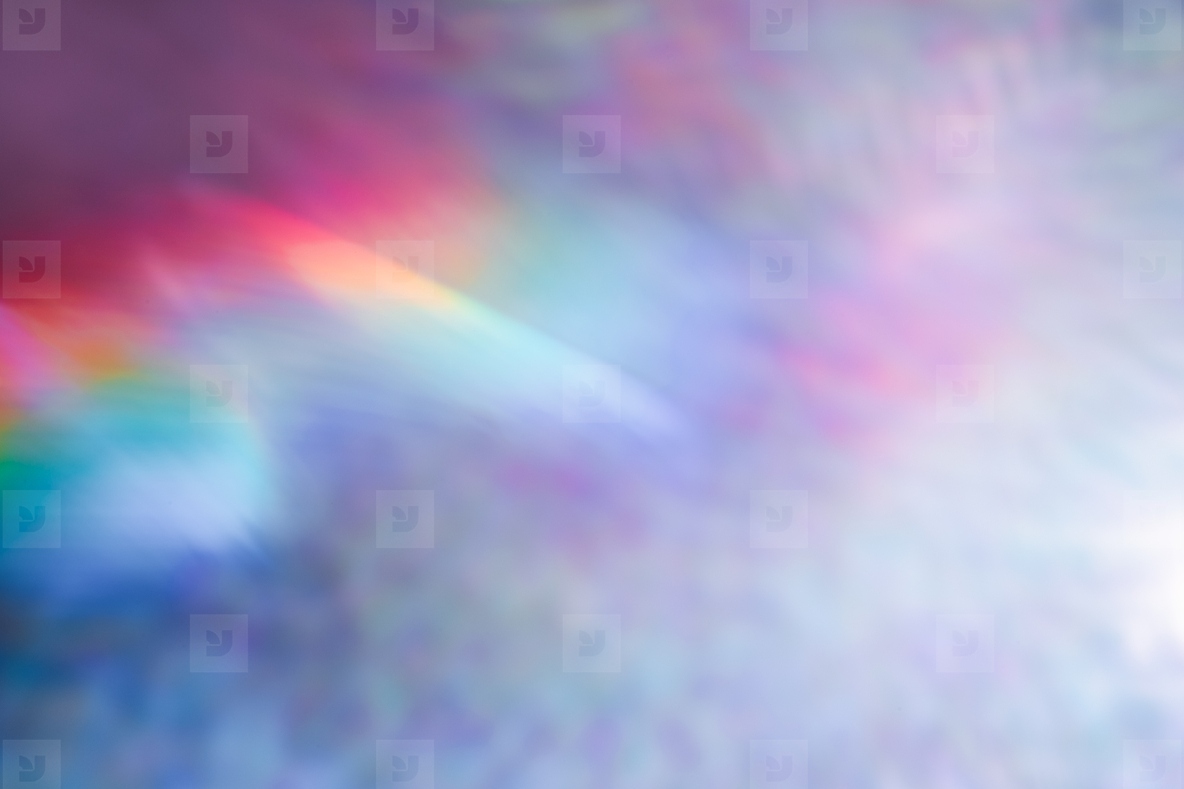 Soft colorful abstract background with blurred light reflections in purple blue and pink tones creating a dreamy gradient texture