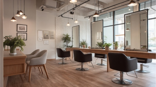 Modern beauty salon interior featuring sleek design  natural light  and stylish furnishings  creating welcoming atmosphere