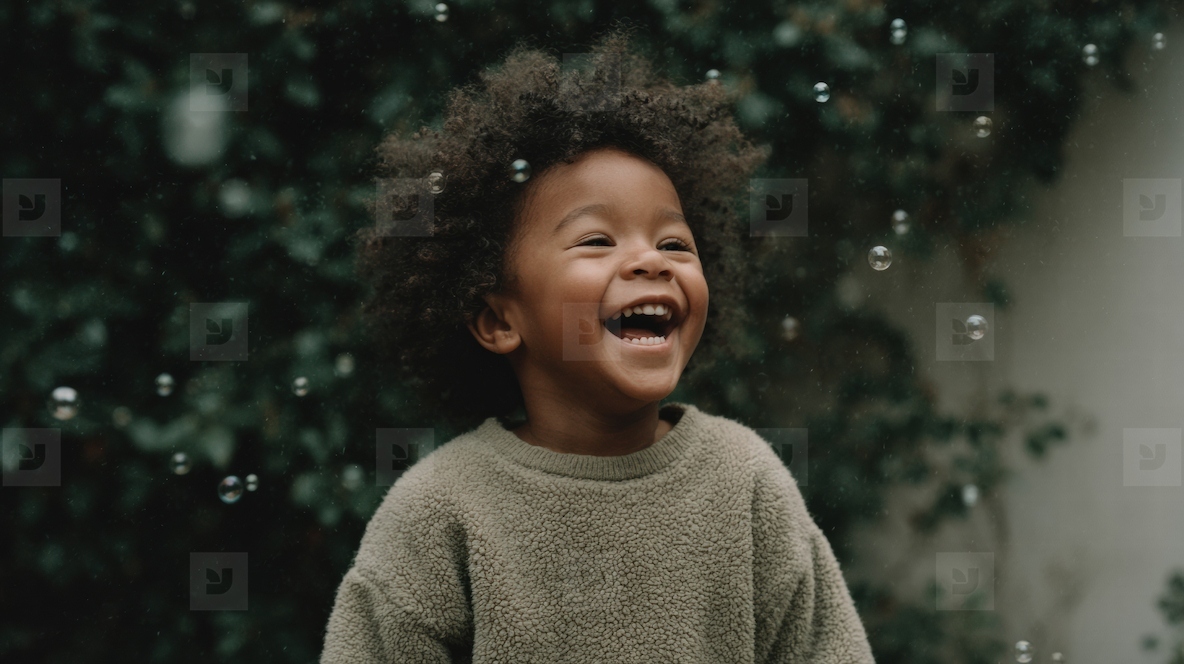 Joyful child laughing while playing with bubbles in garden  surrounded by greenery and cheerful atmosphere