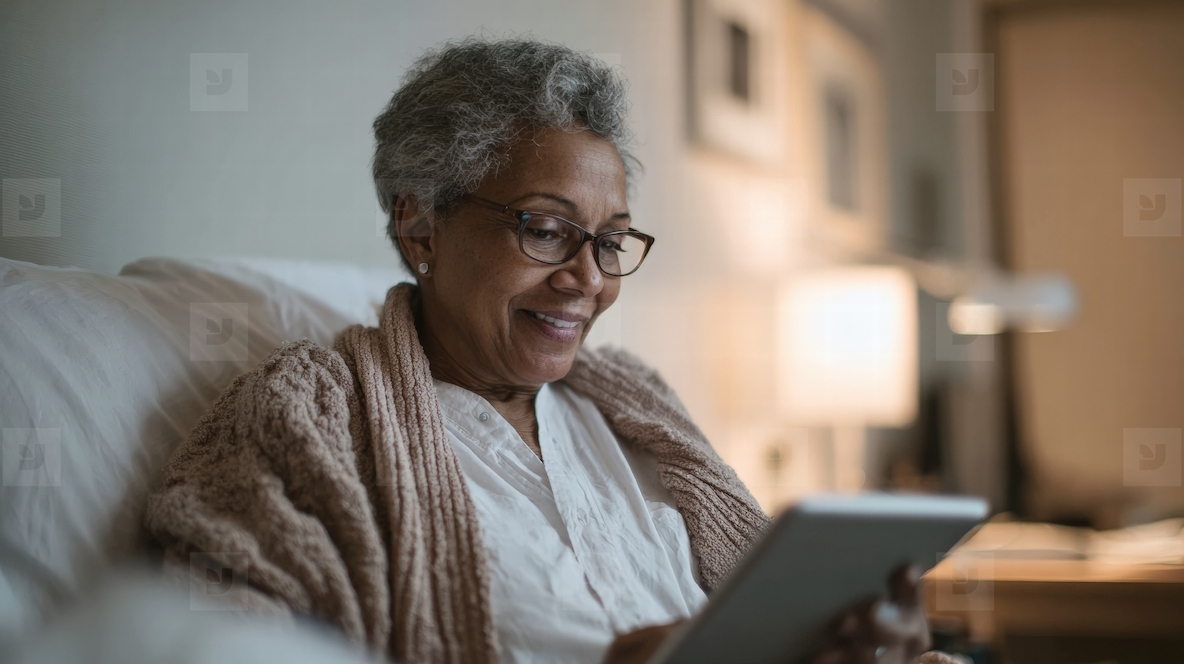 Senior woman using tablet at home smiling and relaxed enjoying technology and connection