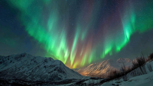 Northern lights dancing in night sky over snow covered mountains create breathtaking view of nature beauty