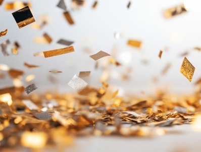 Vibrant display of metallic confetti pieces in gold and silver  creating festive atmosphere