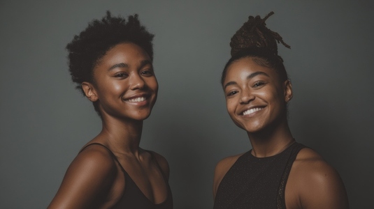 Young black ballerinas posing in studio showcasing joy and confidence Young black ballerinas posing in studio showcasing joy and confidence