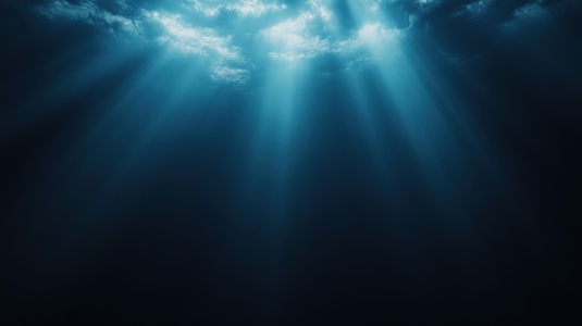 Mysterious underwater scene with beams of light illuminating dark ocean depths