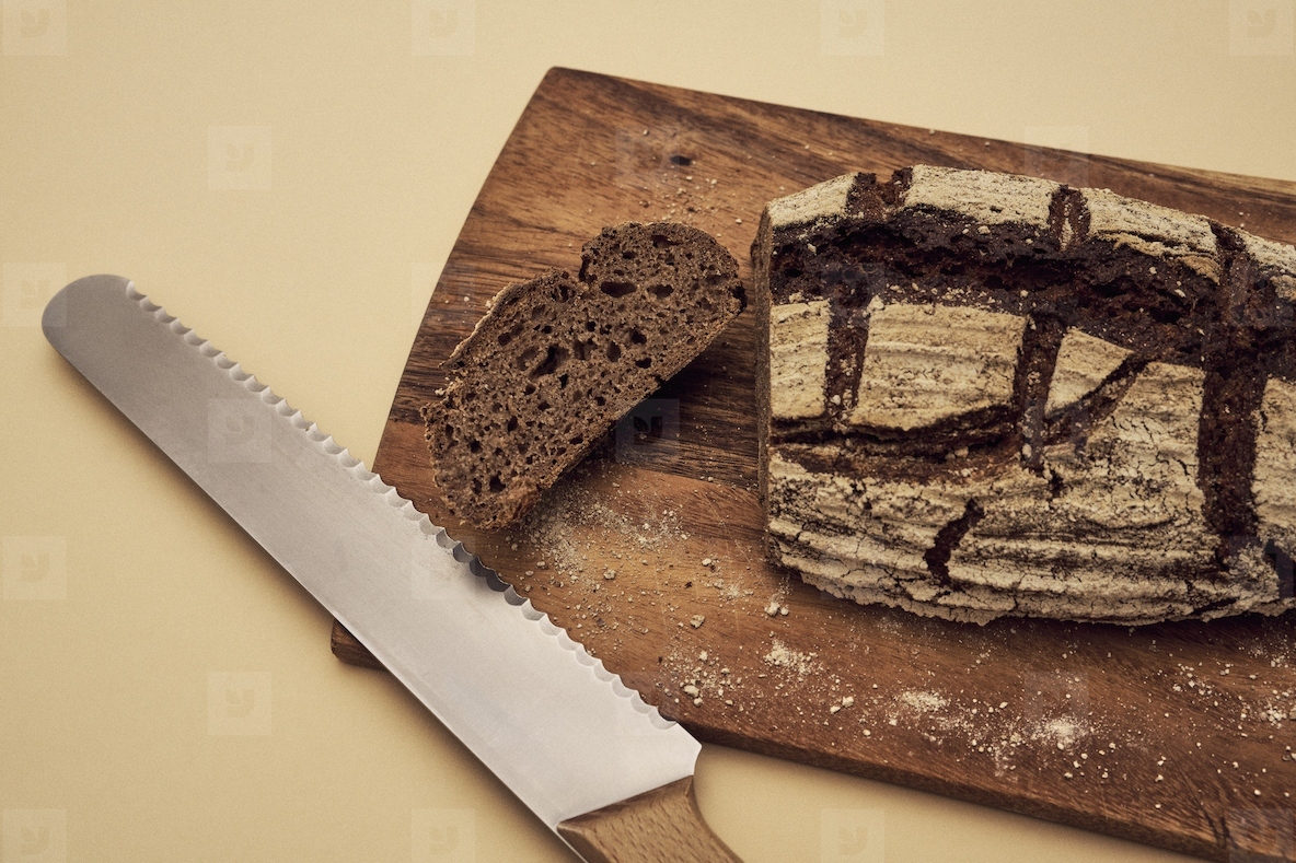 High angle still life of sliced homemade rustic rye bread