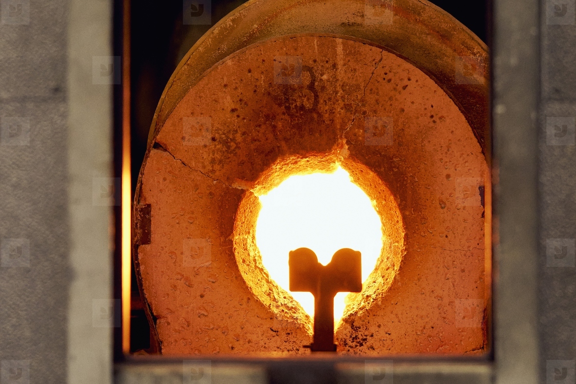 Flame in round opening of hot glassblowing furnace