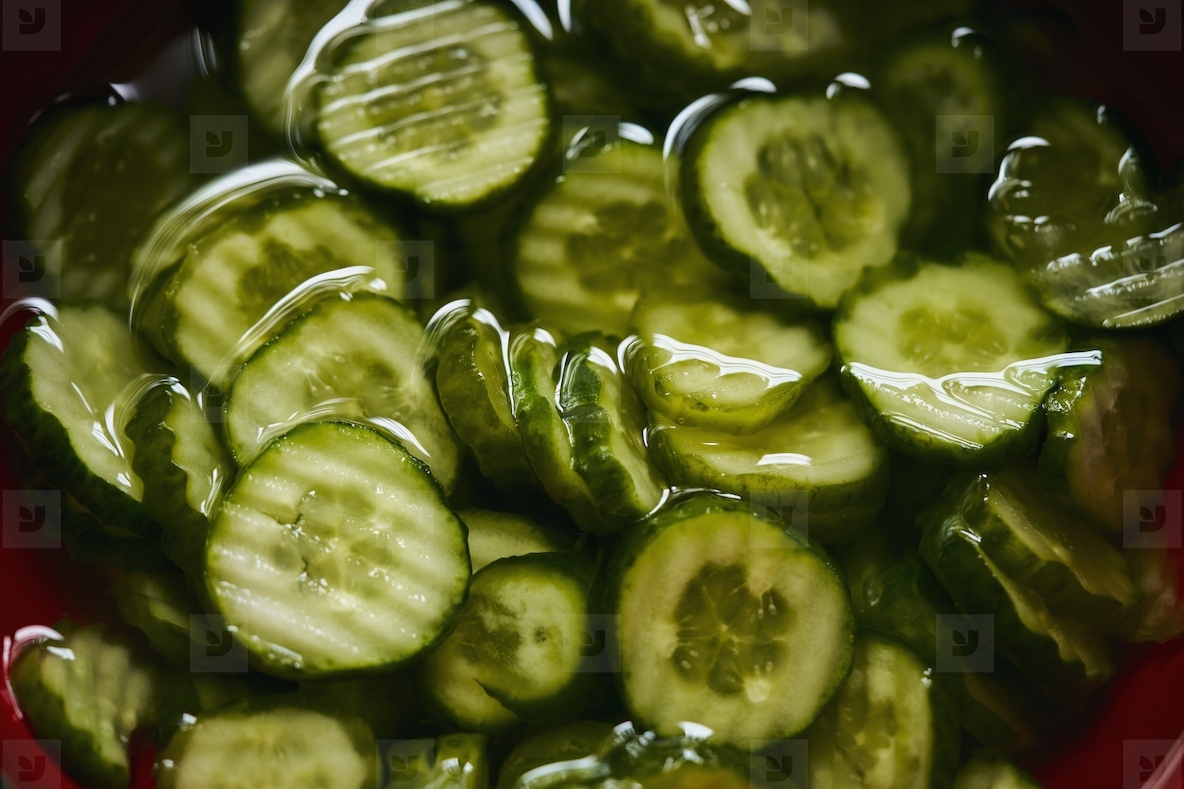 Still life view from above of crinkle cut sliced cucumbers in cucumber salad