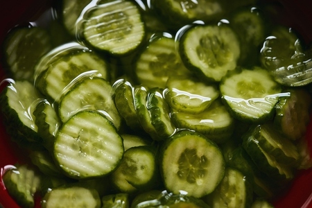 Still life view from above of crinkle cut sliced cucumbers in cucumber salad Still life view from above of crinkle cut sliced cucumbers in cucumber salad