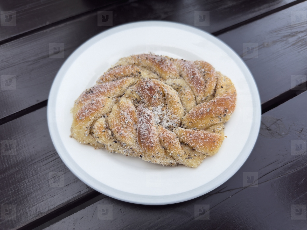 Still life of Swedish cardamom bun on plate
