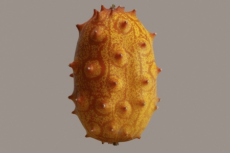 Close up of vibrant yellow and orange horned melon floating