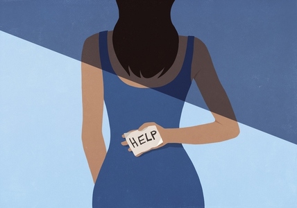 Woman in half shadow holding Help sign behind back